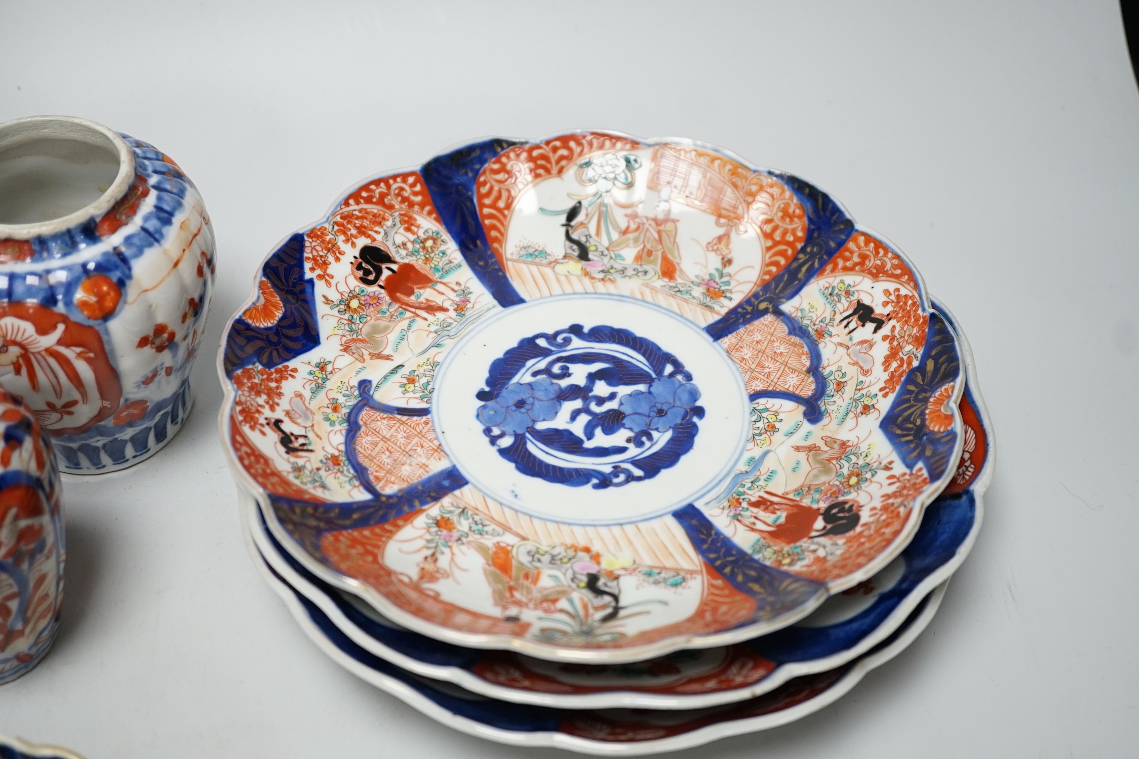 A group of Imari vases and dishes, tallest 19cm